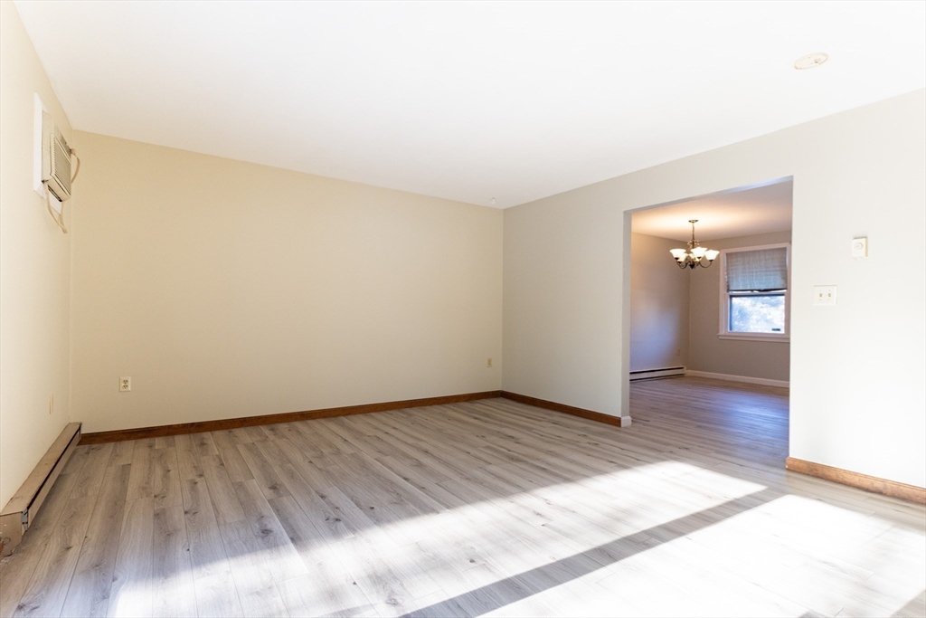 38 Drake Road, Unit 38 Fitchburg, MA 01420 - Photo 12 of 31 a view of an empty room and wooden floor