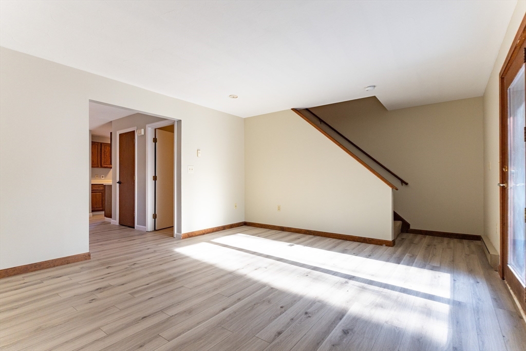 38 Drake Road, Unit 38 Fitchburg, MA 01420 - Photo 14 of 31 a view of an empty room with wooden floor