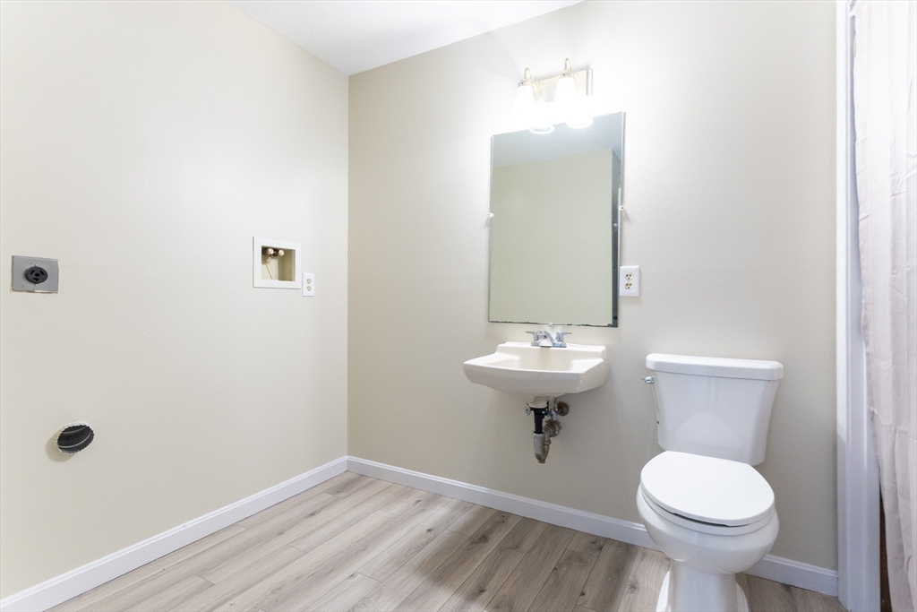 38 Drake Road, Unit 38 Fitchburg, MA 01420 - Photo 15 of 31 a bathroom with a sink toilet and a mirror