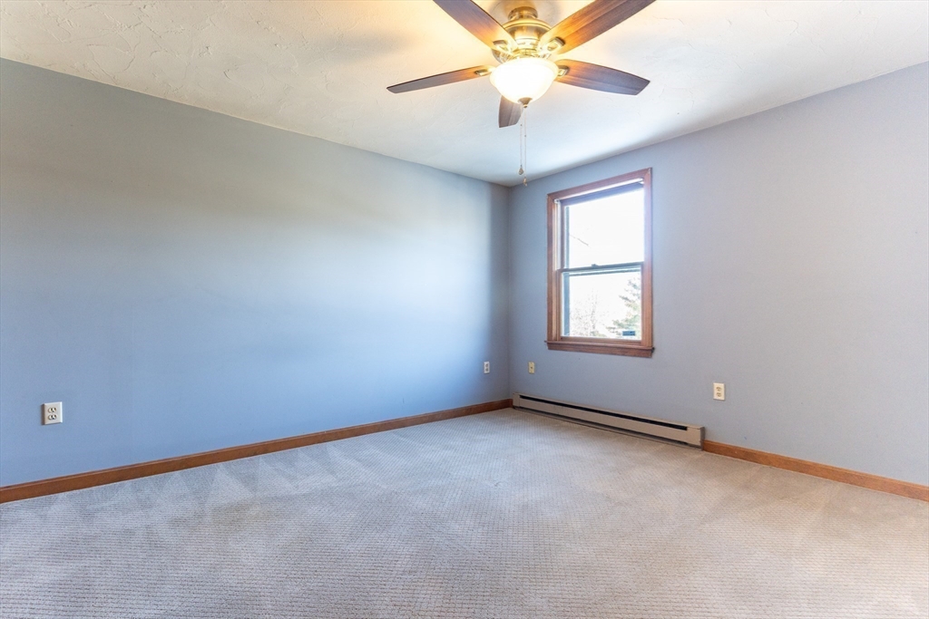 38 Drake Road, Unit 38 Fitchburg, MA 01420 - Photo 23 of 31 an empty room with windows and fan