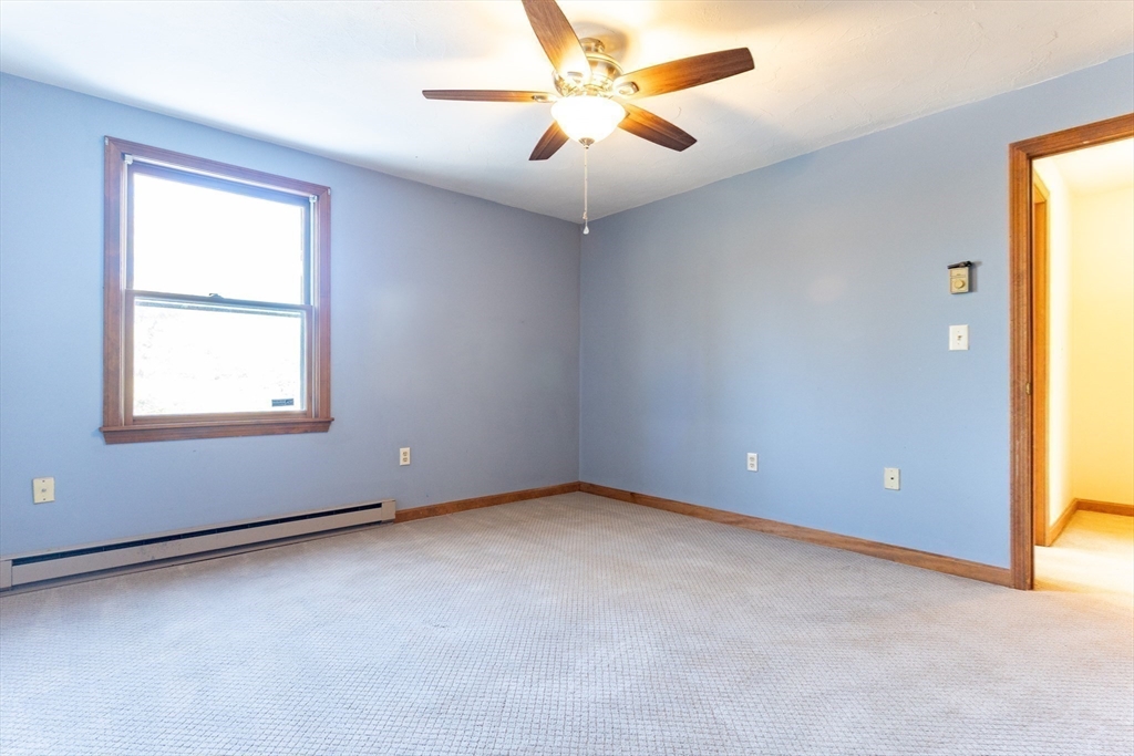 38 Drake Road, Unit 38 Fitchburg, MA 01420 - Photo 5 of 31 an empty room with a window and a fan