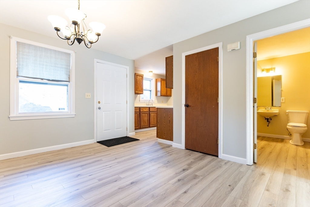 38 Drake Road, Unit 38 Fitchburg, MA 01420 - Photo 9 of 31 a view of a room with wooden floor and a ceiling fan