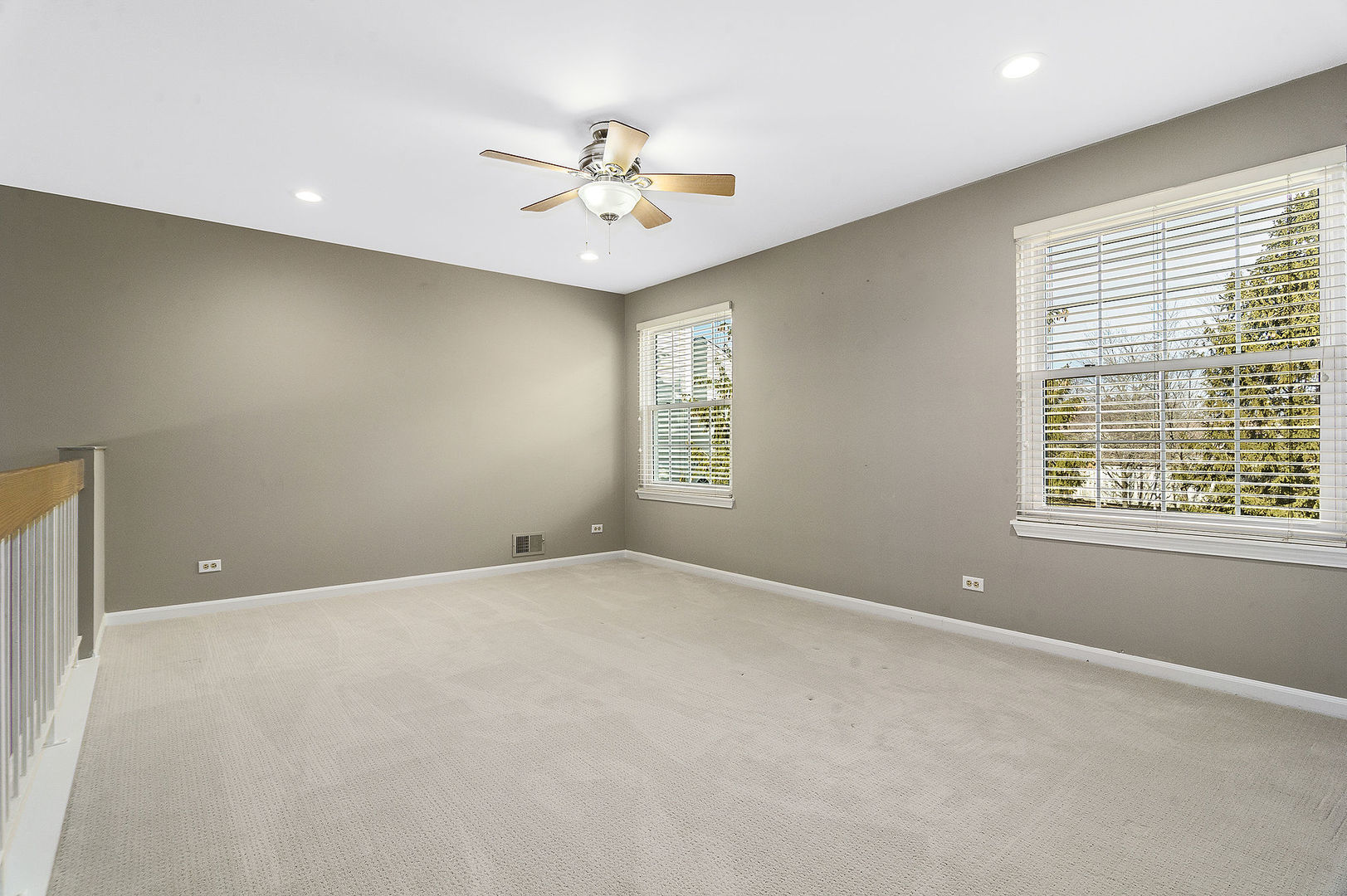 1516 Diamond Drive Hoffman Estates, IL 60192 - Photo 11 of 20 an empty room with windows and fan