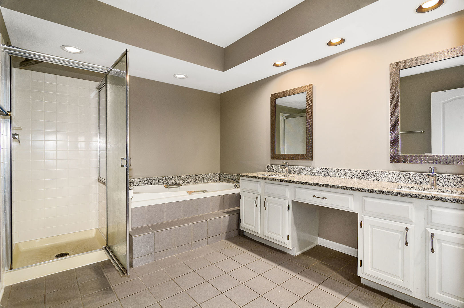 1516 Diamond Drive Hoffman Estates, IL 60192 - Photo 14 of 20 a bathroom with a granite countertop sink mirror and a bathtub