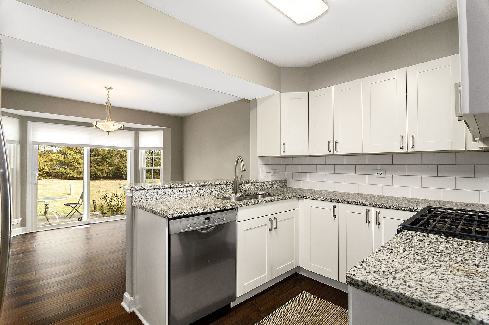 1516 Diamond Drive Hoffman Estates, IL 60192 - Photo 7 of 20 a kitchen with granite countertop a sink stove and cabinets