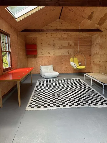 a bathroom with a sink a toilet and a window