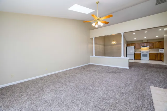 a view of a hallway with a chandelier
