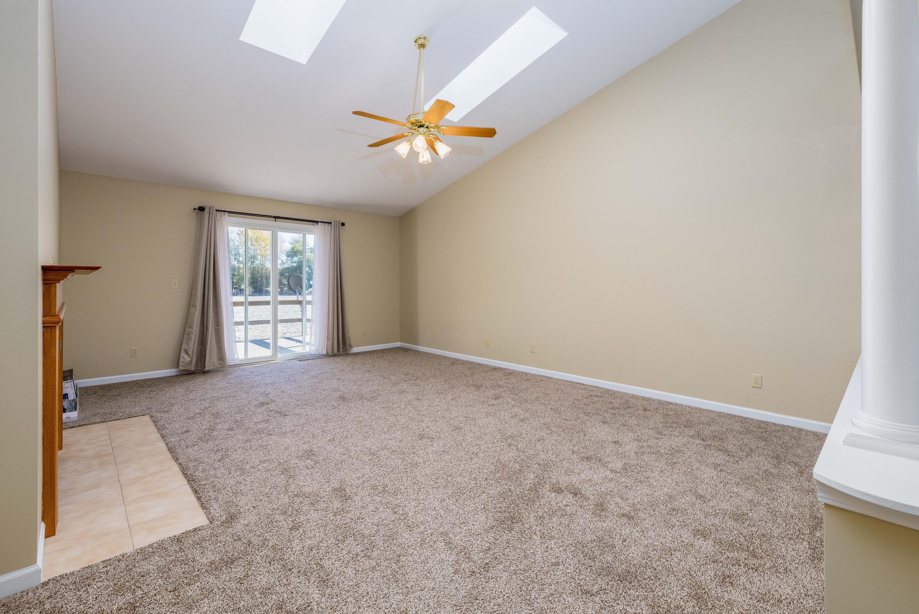 431 Pheasant Run Rensselaer, IN 47978 - Photo 12 of 31 an empty room with windows and fan