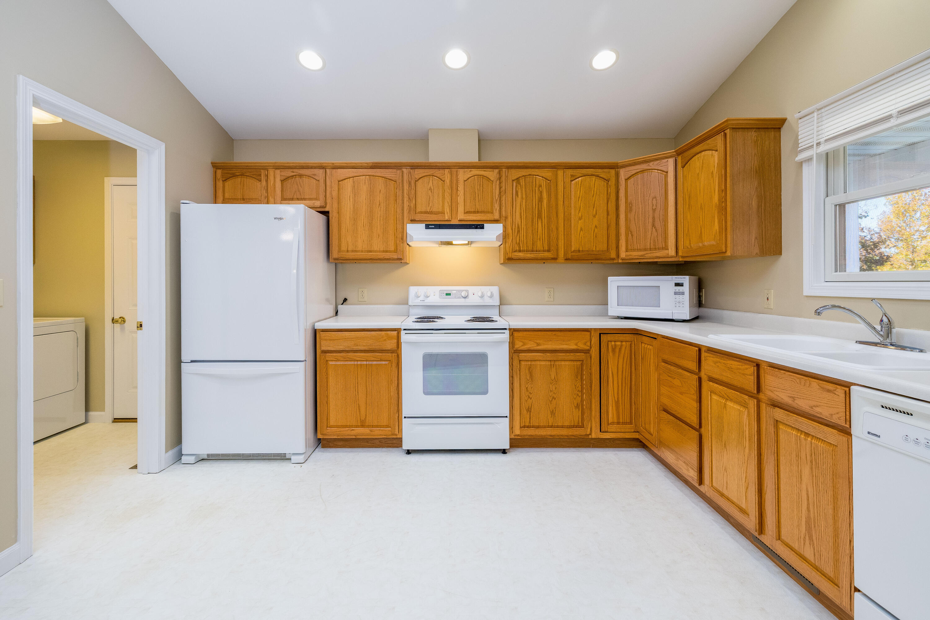 431 Pheasant Run Rensselaer, IN 47978 - Photo 18 of 31 a kitchen with a stove a refrigerator and a sink