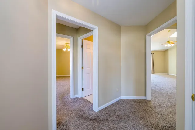 a view of a bathroom with a glass door and a window