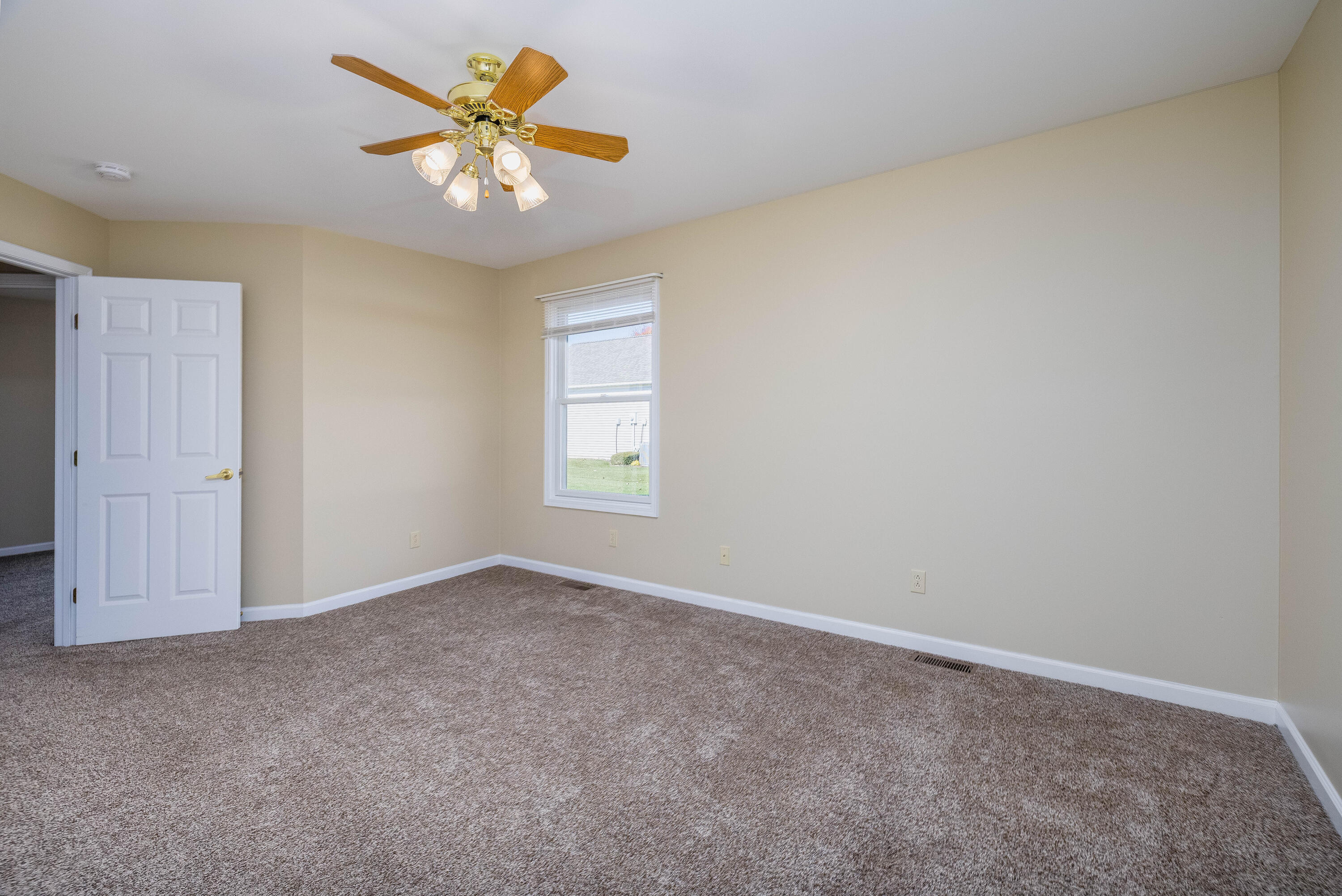 431 Pheasant Run Rensselaer, IN 47978 - Photo 21 of 31 an empty room with closet and a chandelier fan