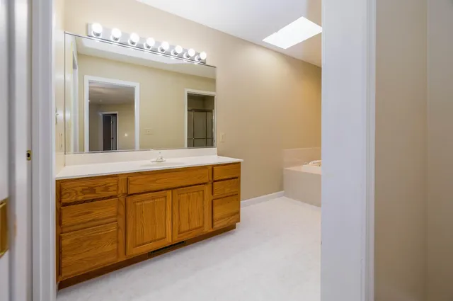 a bathroom with a sink and a mirror