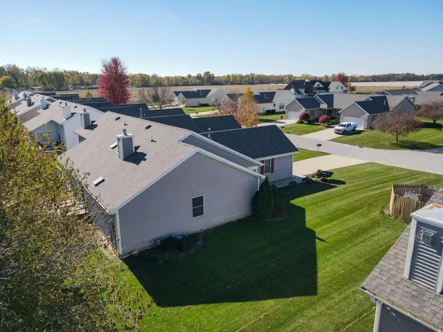 an aerial view of a house with a garden