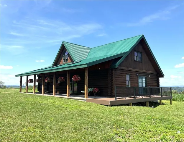 a front view of house with a garden