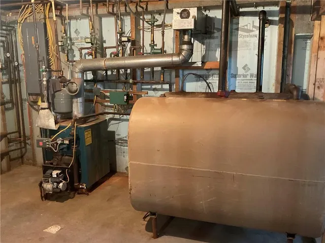 a view of staircase with lots of frames on wall