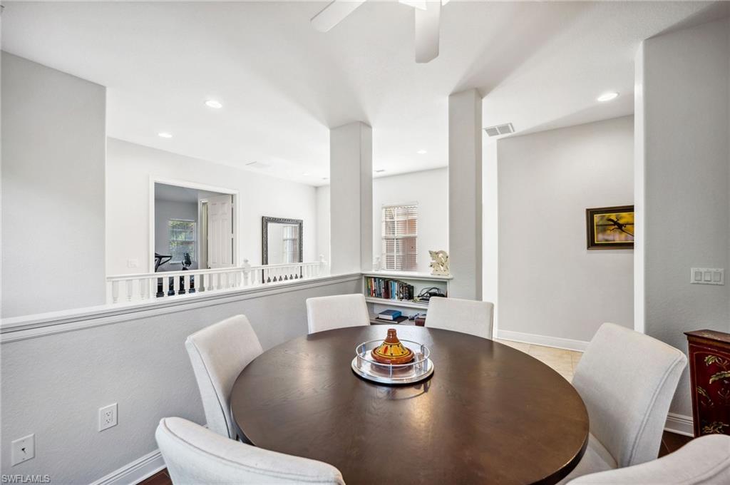 7859 Hawthorne Terrace, Unit 1504 Naples, FL 34113 - Photo 14 of 43 a view of a dining room with furniture