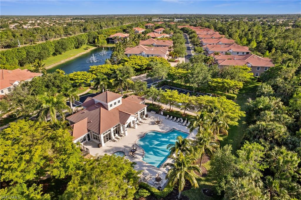 7859 Hawthorne Terrace, Unit 1504 Naples, FL 34113 - Photo 35 of 43 an aerial view of residential houses with outdoor space