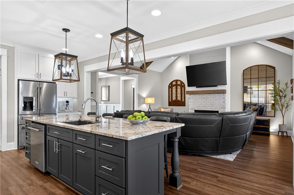 353 Newt Green Road Ball Ground, GA 30107 - Photo 18 of 52 a living room with granite countertop furniture and wooden floor