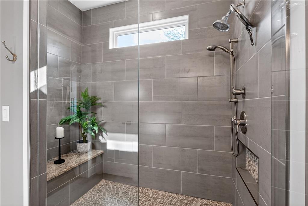 353 Newt Green Road Ball Ground, GA 30107 - Photo 26 of 52 a bathroom with a shower and a sink