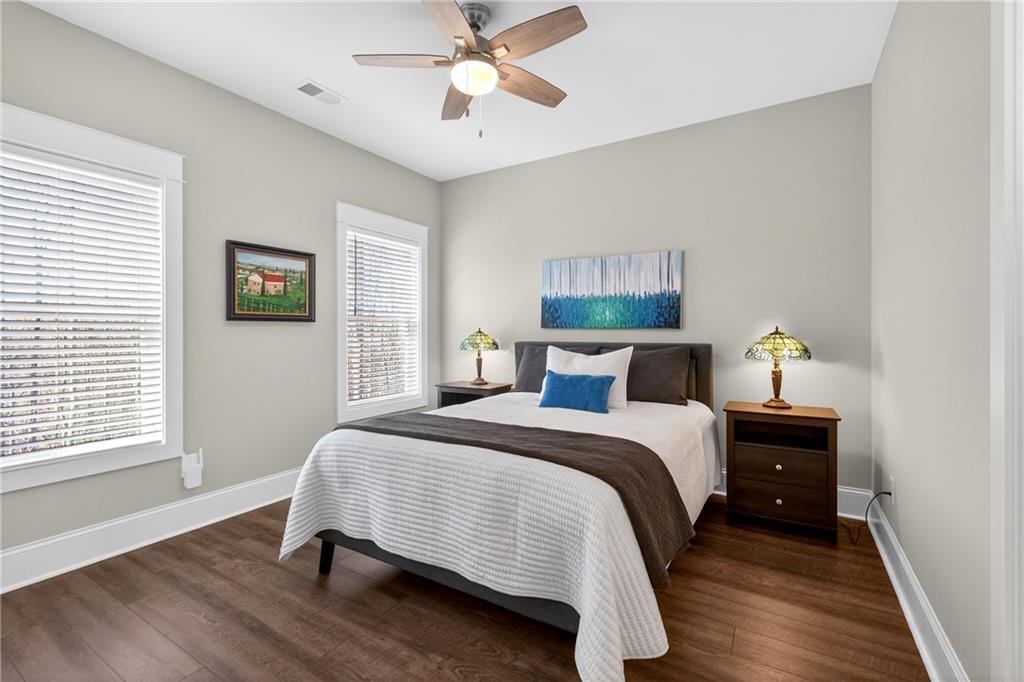 353 Newt Green Road Ball Ground, GA 30107 - Photo 31 of 52 a bedroom with a bed and a window