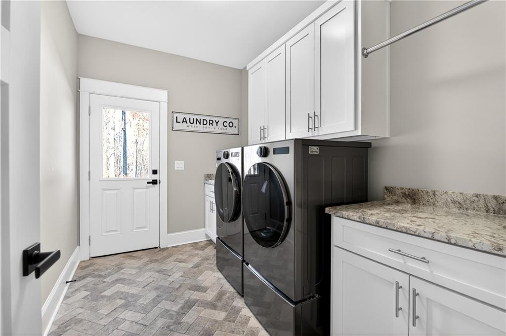 353 Newt Green Road Ball Ground, GA 30107 - Photo 33 of 52 a utility room with dryer and washer