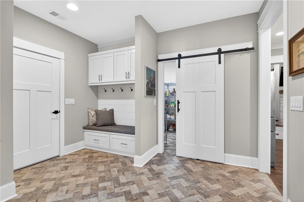 353 Newt Green Road Ball Ground, GA 30107 - Photo 34 of 52 a view of kitchen with white cabinets and refrigerator