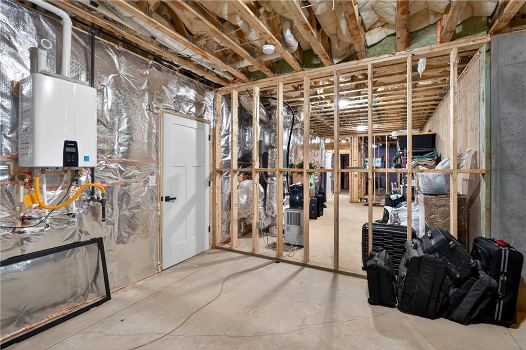 353 Newt Green Road Ball Ground, GA 30107 - Photo 36 of 52 a view of a storage room with shelves