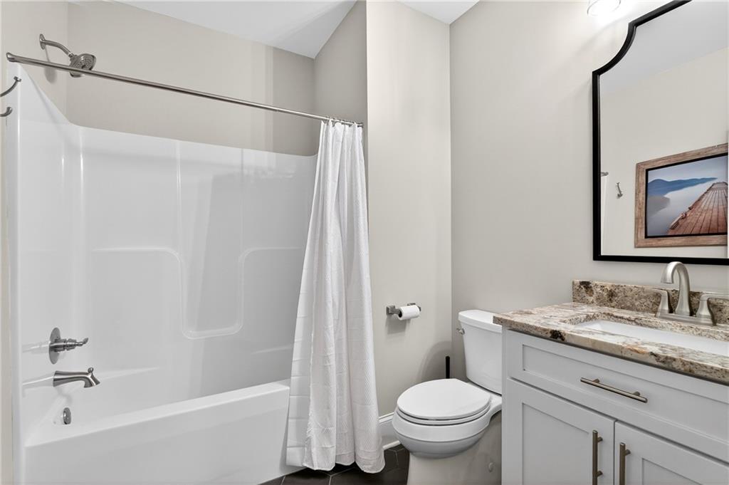 353 Newt Green Road Ball Ground, GA 30107 - Photo 41 of 52 a bathroom with a sink toilet and shower
