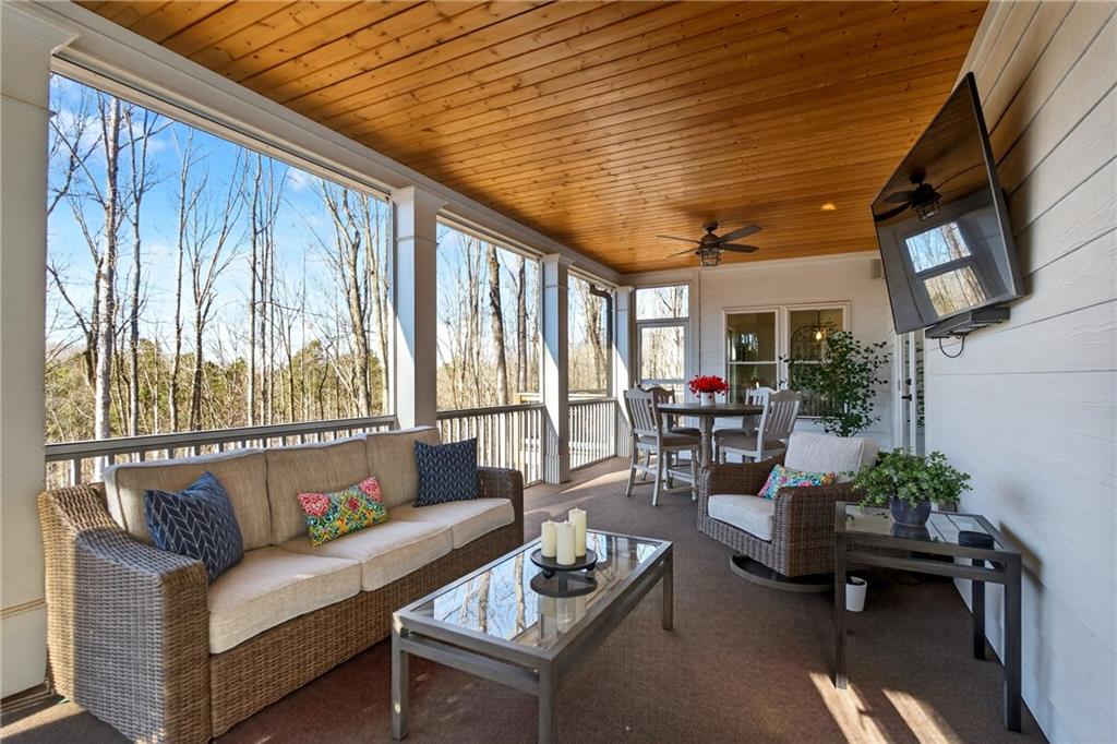 353 Newt Green Road Ball Ground, GA 30107 - Photo 43 of 52 a living room with furniture and a large window