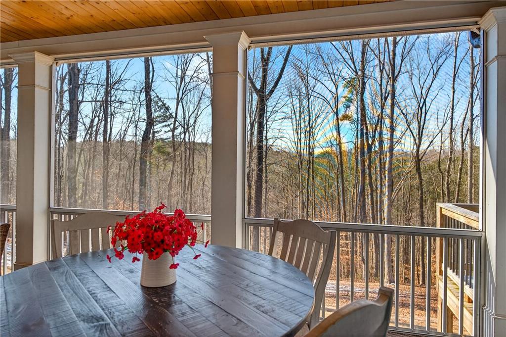 353 Newt Green Road Ball Ground, GA 30107 - Photo 44 of 52 a dining room with furniture and wooden floor