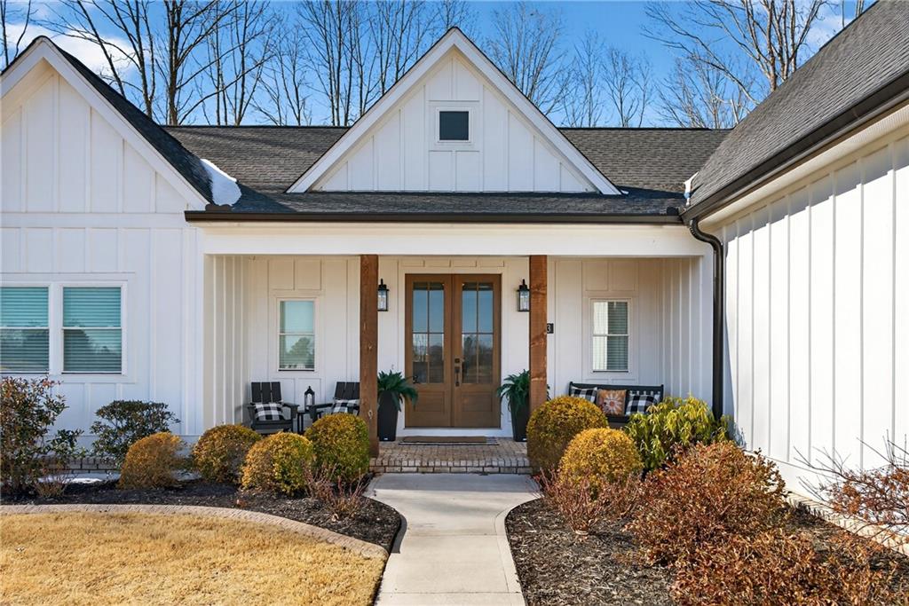 353 Newt Green Road Ball Ground, GA 30107 - Photo 6 of 52 a front view of a house with garden