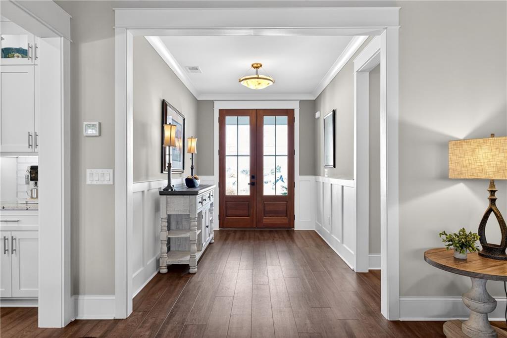 353 Newt Green Road Ball Ground, GA 30107 - Photo 9 of 52 a view of a hallway view with wooden floor and furniture