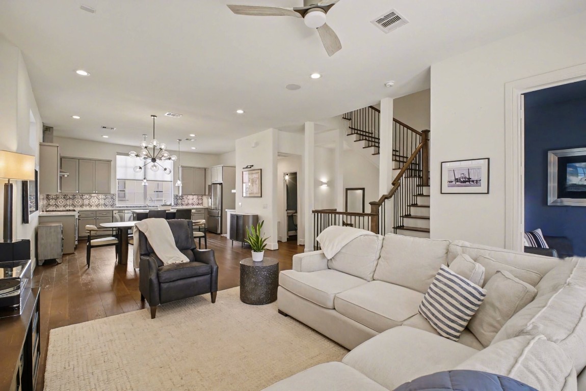 3507 Ridgeway Valley Lane Houston, TX 77055 - Photo 4 of 50 This inviting open-concept living space seamlessly combines a cozy lounge area with a modern kitchen and dining space, perfect for both relaxation and entertaining.