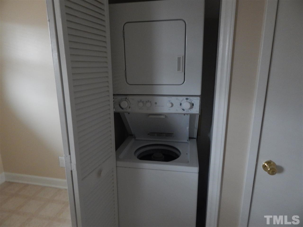623 Daniels Street, Unit D Raleigh, NC 27605 - Photo 3 of 6 a close view of a utility room with dryer and washer