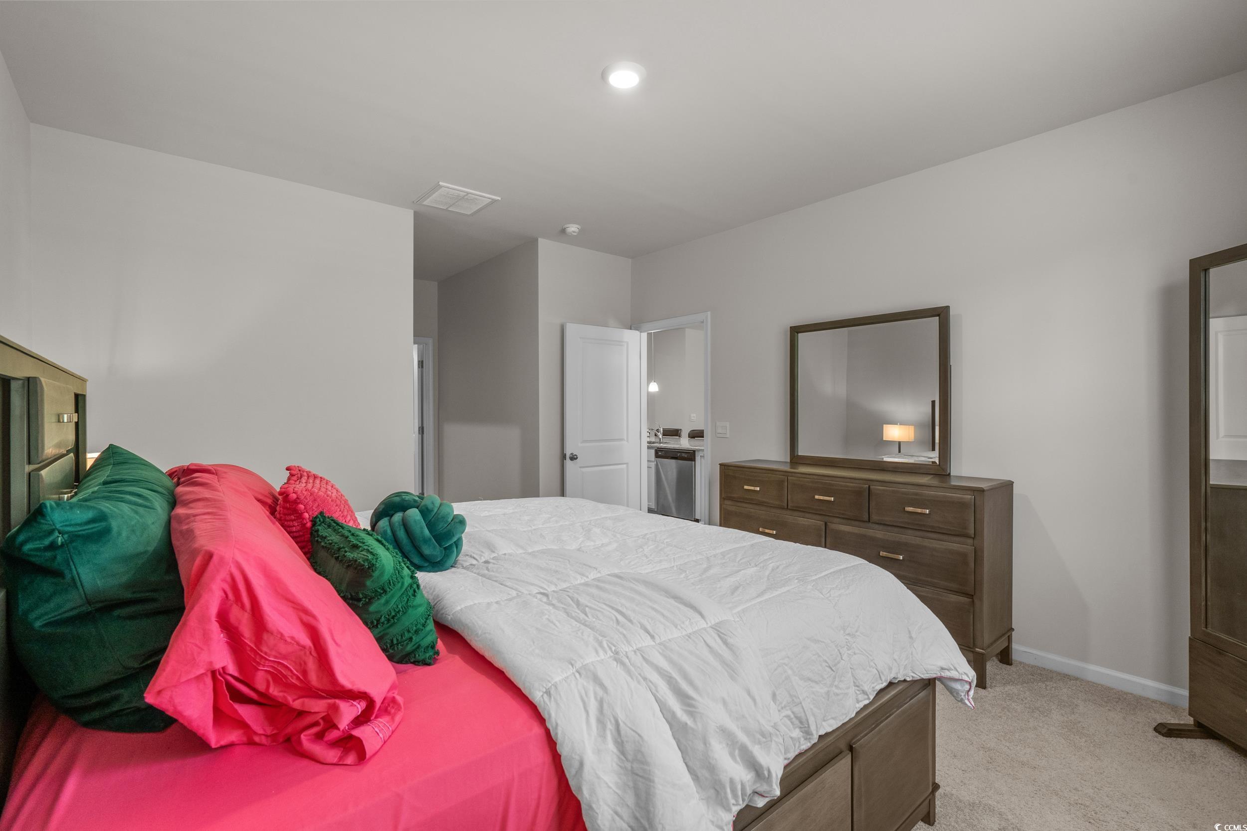 847 Flowering Br Avenue Little River, SC 29566 - Photo 15 of 30 Bedroom with light colored carpet and baseboards