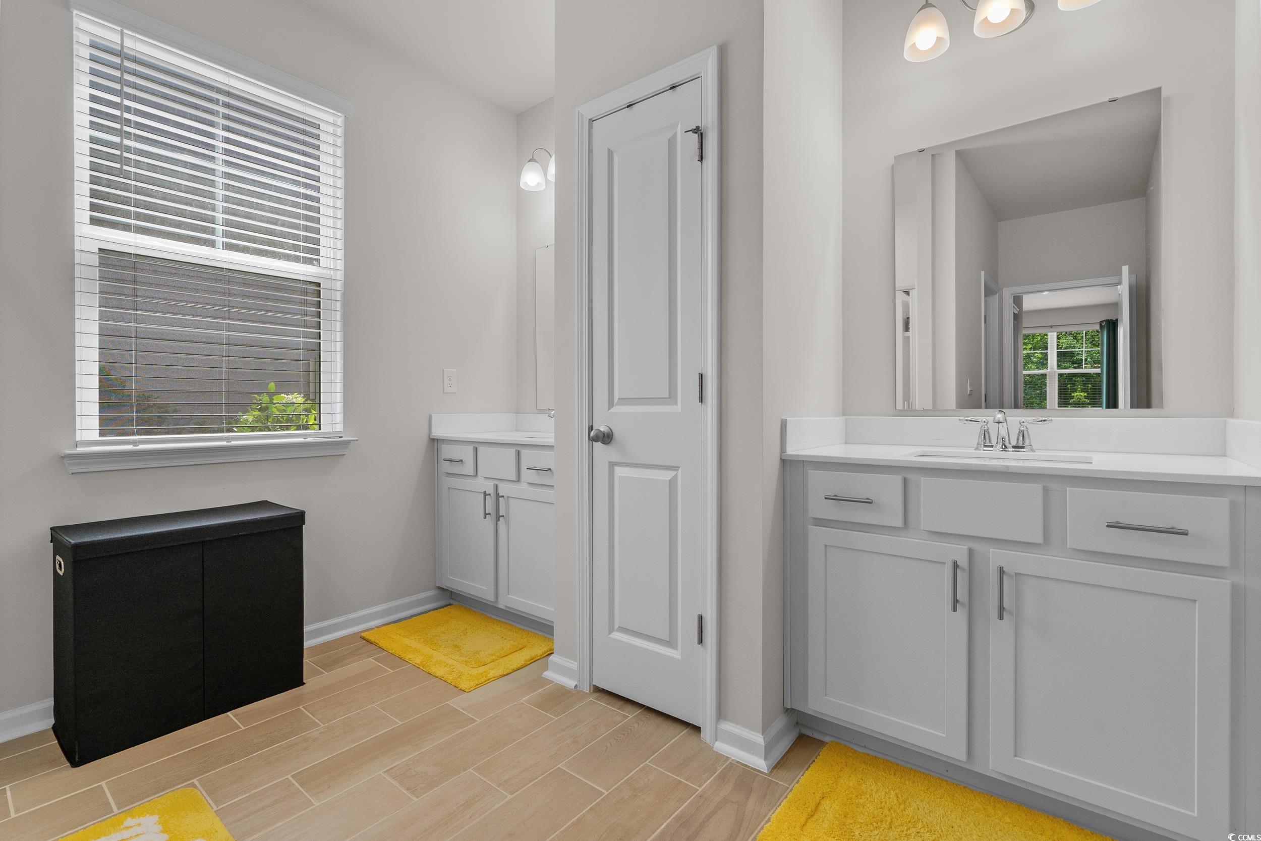 847 Flowering Br Avenue Little River, SC 29566 - Photo 16 of 30 Bathroom featuring two vanities and wood tiled floors
