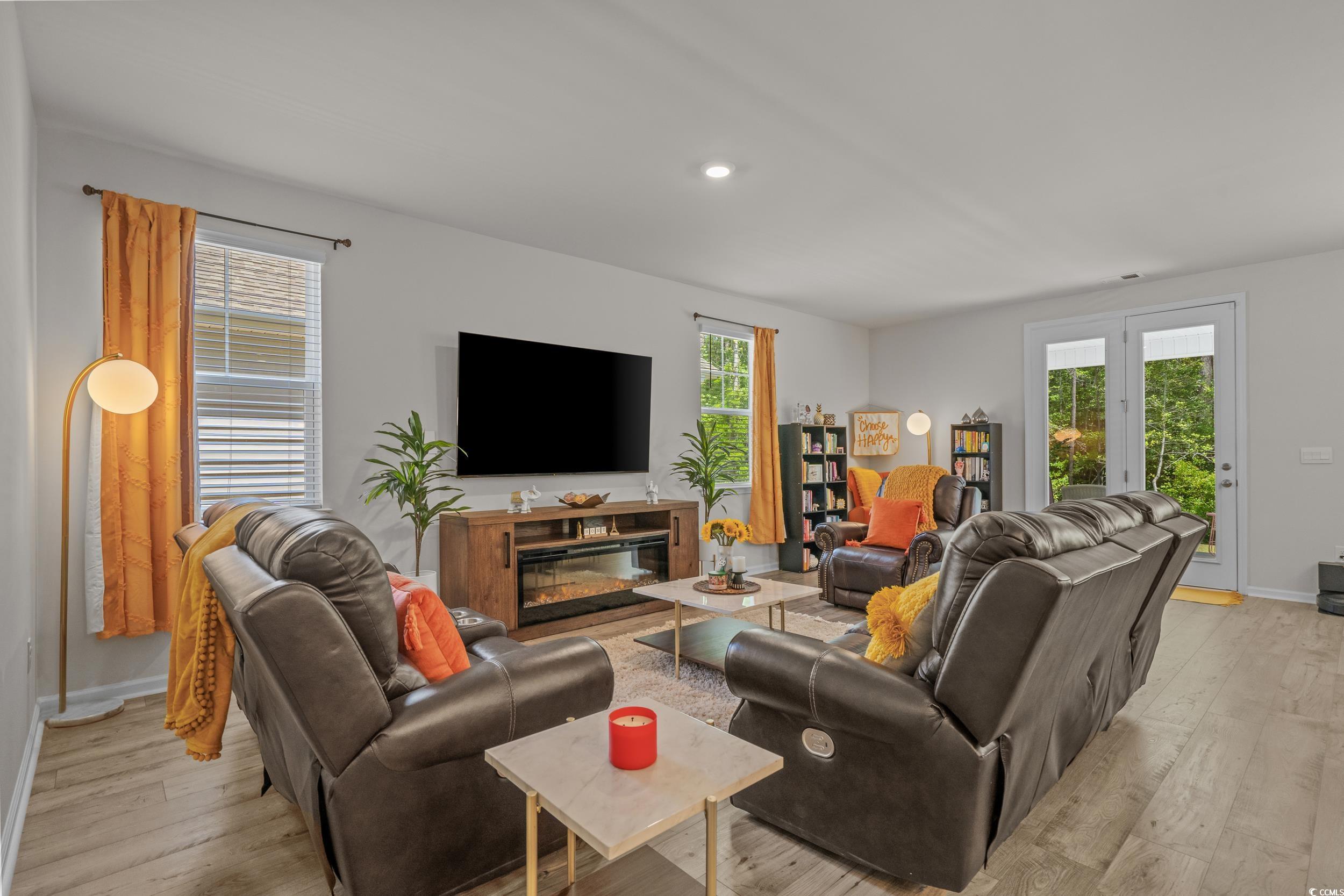 847 Flowering Br Avenue Little River, SC 29566 - Photo 3 of 30 Living room with plenty of natural light, light wood finished floors, recessed lighting, and french doors