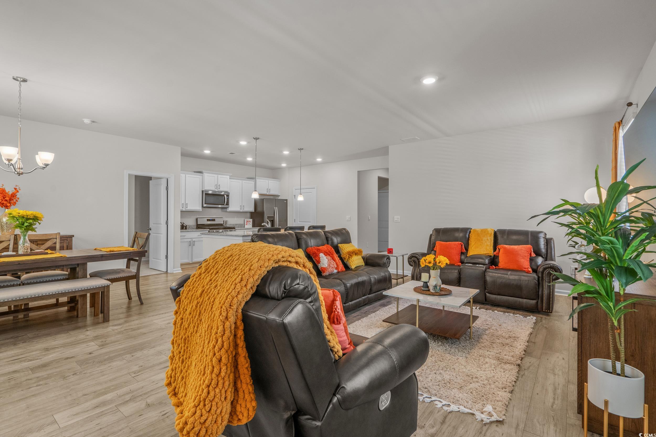 847 Flowering Br Avenue Little River, SC 29566 - Photo 6 of 30 Living area with light wood-style flooring, recessed lighting, and a chandelier