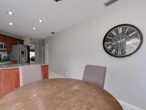 20851 Boca Ridge Drive North Boca Raton, FL 33428 - Photo 16 of 36 a view of a kitchen with furniture and a kitchen