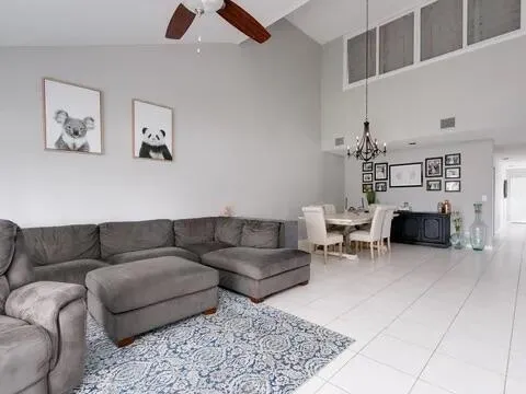 a bedroom with a large bed and a large window