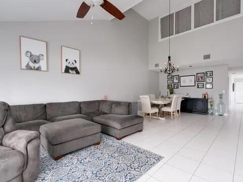 20851 Boca Ridge Drive North Boca Raton, FL 33428 - Photo 19 of 36 a living room with furniture and a rug