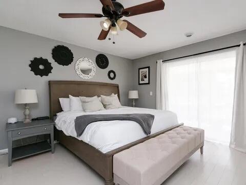 20851 Boca Ridge Drive North Boca Raton, FL 33428 - Photo 20 of 36 a bedroom with bed and a large window