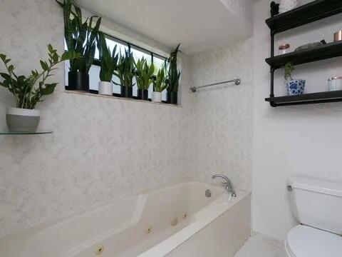 20851 Boca Ridge Drive North Boca Raton, FL 33428 - Photo 24 of 36 a white bath tub sitting next to a toilet