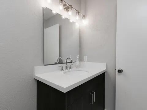 20851 Boca Ridge Drive North Boca Raton, FL 33428 - Photo 26 of 36 a bathroom with a sink and a mirror