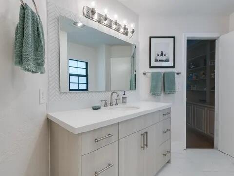 20851 Boca Ridge Drive North Boca Raton, FL 33428 - Photo 30 of 36 a bathroom with a sink and a mirror