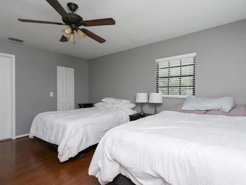 20851 Boca Ridge Drive North Boca Raton, FL 33428 - Photo 32 of 36 a bedroom with two beds and a chandelier