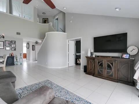20851 Boca Ridge Drive North Boca Raton, FL 33428 - Photo 6 of 36 a living room with furniture and a flat screen tv