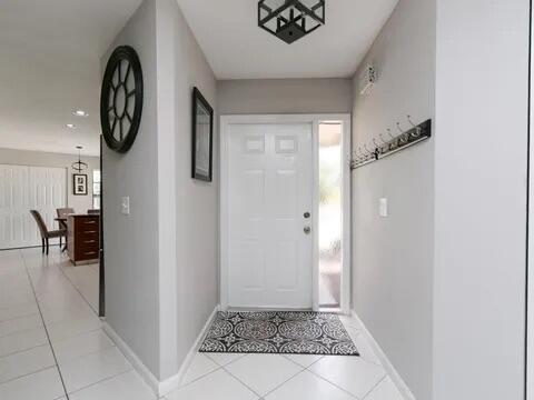 20851 Boca Ridge Drive North Boca Raton, FL 33428 - Photo 8 of 36 a view of an entryway with wooden floor