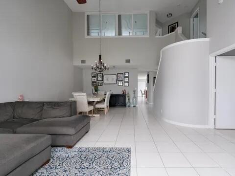 20851 Boca Ridge Drive North Boca Raton, FL 33428 - Photo 10 of 36 a living room with furniture and a fireplace