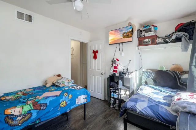 a bedroom with a bed furniture and a window